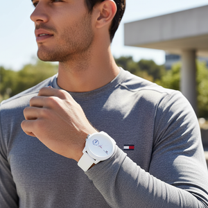 Man wearing Tommy Hilfiger Duo white rubber watch for a sharp, trendy, and minimalist everyday look