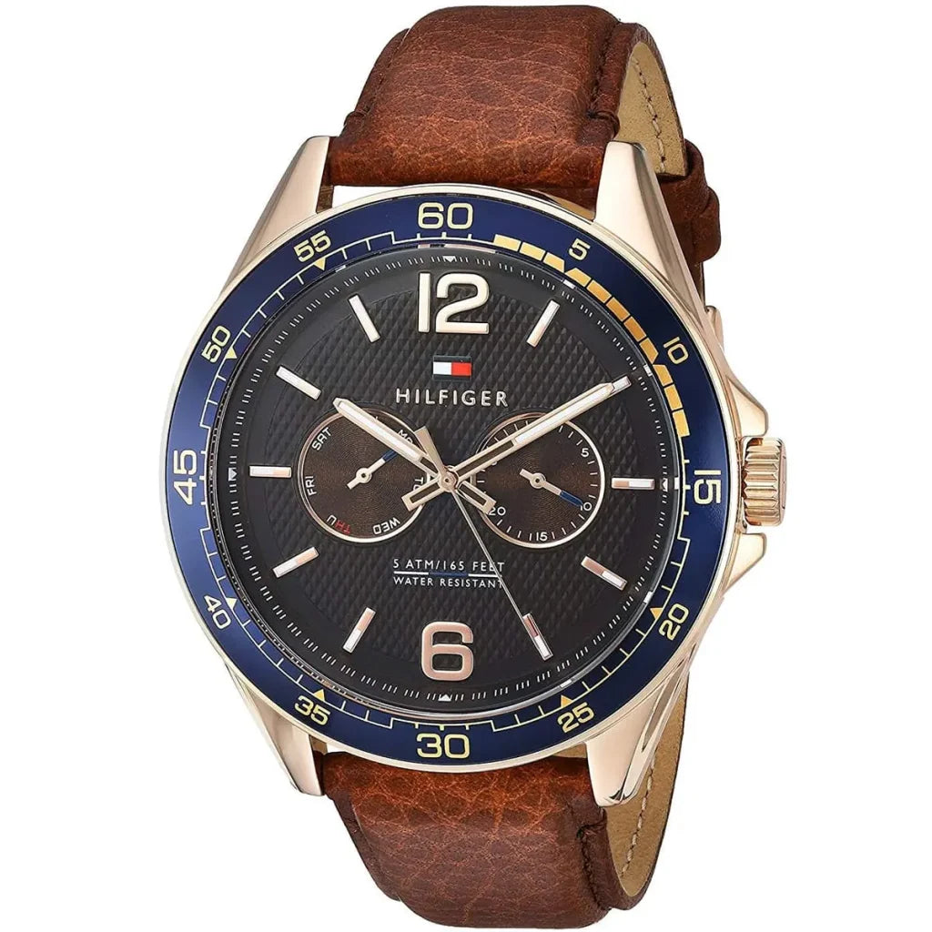Angled view of the Tommy Hilfiger 1791367 highlighting the rose gold case and blue bezel contrast