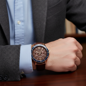 Male model wearing Tommy Hilfiger 1791367 rose gold watch with a smart casual outfit