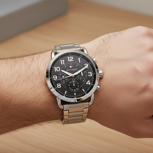 Close up shot of Tommy Hilfiger 1791422 watch on wrist showing the bold black dial and sub-dials