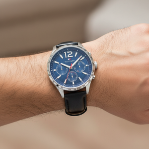 Close up shot of Tommy Hilfiger 1791468 watch on wrist showing the blue multifunction dial