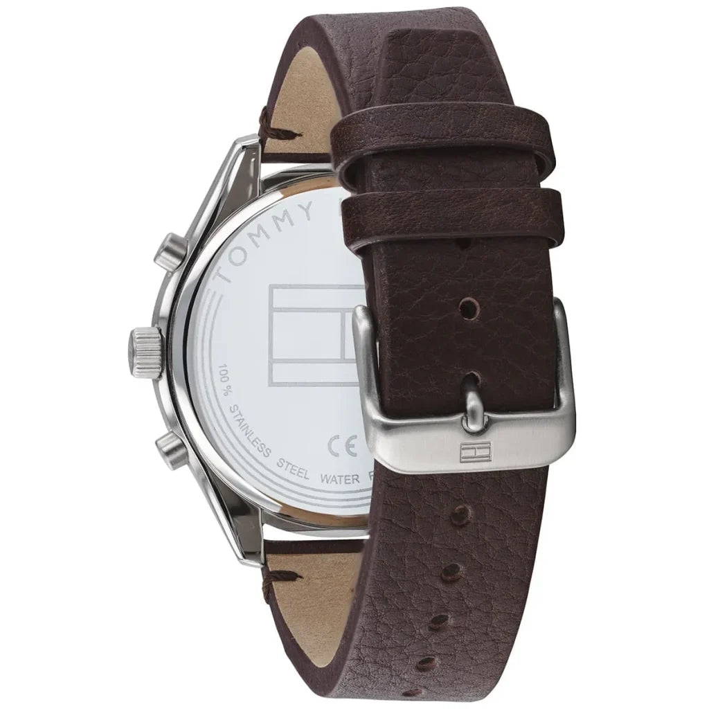 Left side perspective of the silver case and detailed stitching on the brown leather strap of the Tommy Hilfiger watch