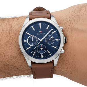Close up shot of Tommy Hilfiger 1791741 watch on wrist showing the blue multifunction dial