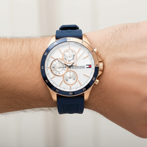 Close up shot of Tommy Hilfiger 1791778 on wrist showing the white dial with gold-tone sub-dials and accents