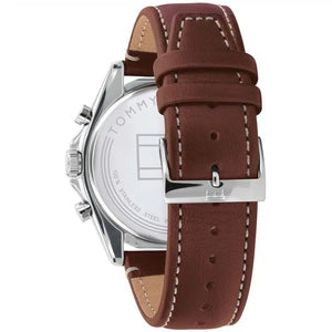 Left side perspective of the silver case and detailed stitching on the brown leather strap of the Tommy Hilfiger watch