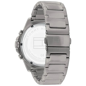 Left side perspective of the gunmetal case and gold bezel details of the Tommy Hilfiger watch
