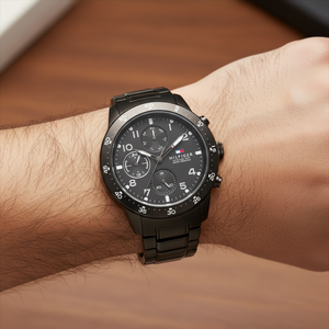 Close up shot of Tommy Hilfiger 1791951 on wrist showing the matte black dial with multi-function sub-dials and sporty bezel