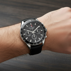 Close up shot of Tommy Hilfiger 1791964 on wrist showing the black dial with multi-function sub-dials and silver-tone hands