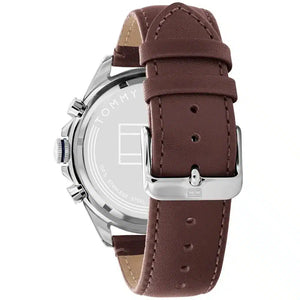 Left side perspective of the silver case and detailed stitching on the brown leather strap of the Tommy Hilfiger watch