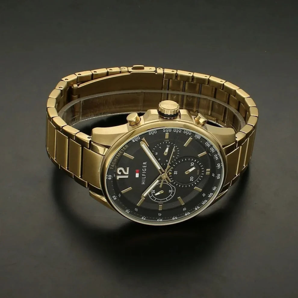 Left side perspective of the gold case and link bracelet details of the Tommy Hilfiger watch