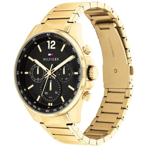 Man wearing Tommy Hilfiger Damon gold metal watch for a sophisticated, luxurious, and elegant professional look