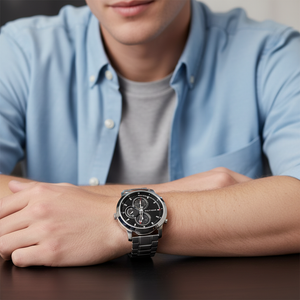 Male model wearing Tommy Hilfiger 1792048 silver watch with a formal business suit