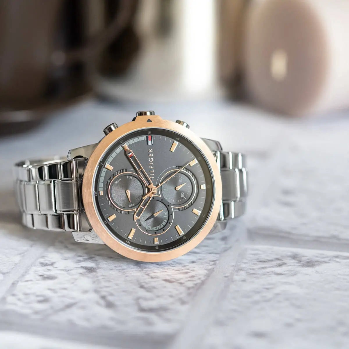 Side profile view of the 10mm case of the Tommy Hilfiger 1792050 showing rose gold details