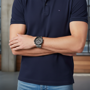 Male model wearing Tommy Hilfiger 1792106 silver watch with a smart sporty casual outfit