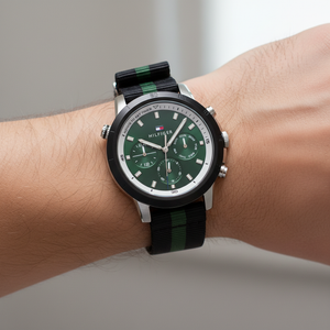 Detailed macro view of the green dial and internal rotating timer bezel of Tommy Hilfiger 1792107