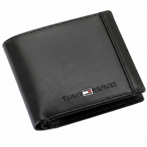 Professional studio shot of the Tommy Hilfiger men's black genuine leather bifold wallet with signature vertical branding detail