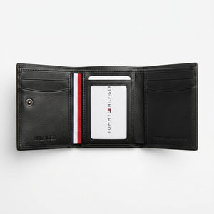 Internal layout view of the Tommy Hilfiger leather bi-fold wallet showcasing organized card slots and signature color stripe detail