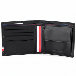 An open view of the Tommy Hilfiger black leather bifold wallet showcasing the spacious bill compartment and internal designer branding