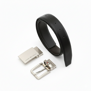 Full perspective view of the Tommy Hilfiger men's black leather belt with its two stylish interchangeable buckles, perfect for casual and formal wear