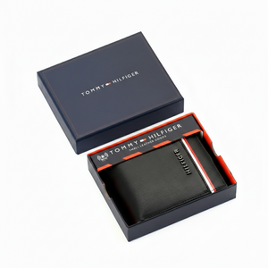 Tommy Hilfiger men's black leather wallet with a horizontal red and white signature stripe, presented in its original navy blue gift box
