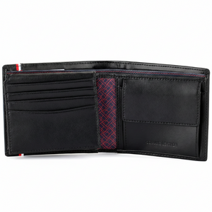 Interior view of a Tommy Hilfiger black leather wallet showing card slots, a coin compartment, and branded signature interior lining