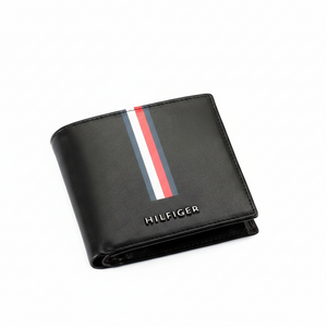 Close-up of Tommy Hilfiger black men's wallet highlighting the vertical signature stripe and raised silver-tone metal logo
