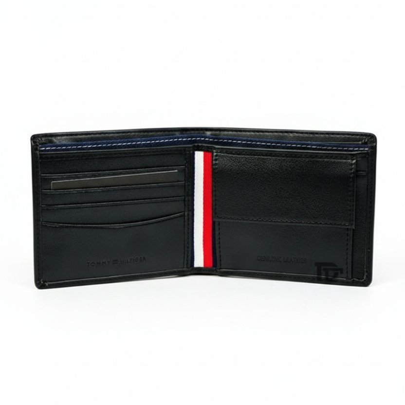 Interior layout of Tommy Hilfiger black wallet showing snap button coin pocket, card slots, and signature tricolor stripe lining
