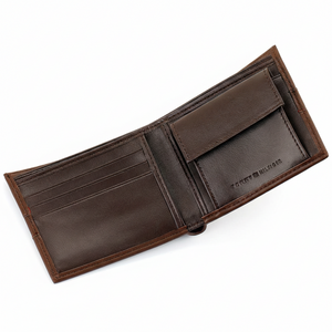 Detailed interior of the Tommy Hilfiger brown leather wallet featuring multiple card slots, a secure button-fastened coin pocket, and a spacious bill compartment