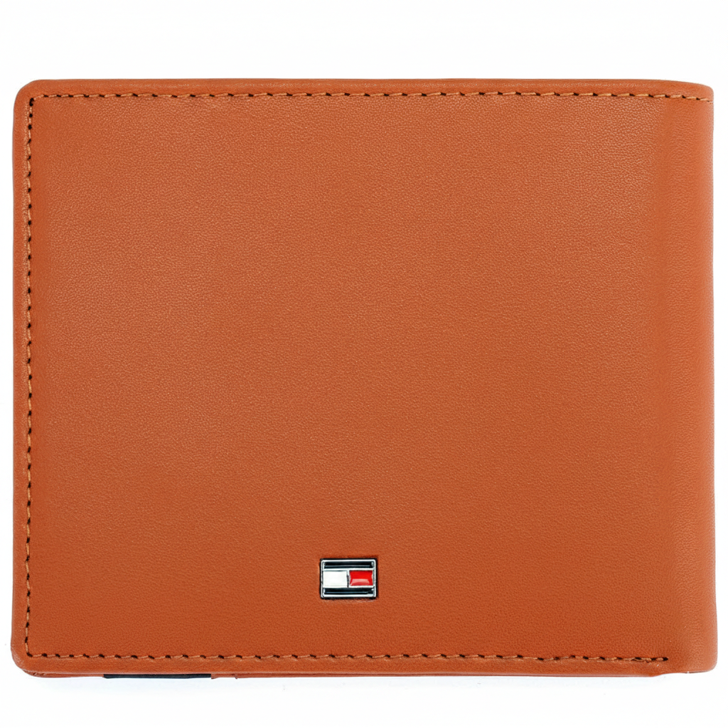 Rear perspective of the Tommy Hilfiger camel leather wallet showing the clean finish and a small silver-toned enamel flag logo