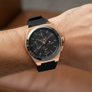 Close up of black dial and gold-tone multi-function sub-dials of Tommy Hilfiger 1791931