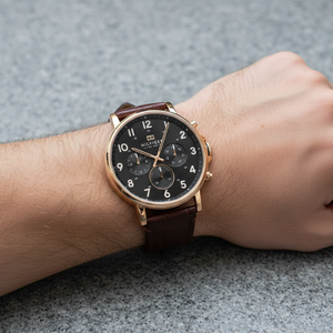 Close up of black dial and gold-tone markers of Tommy Hilfiger 1710379