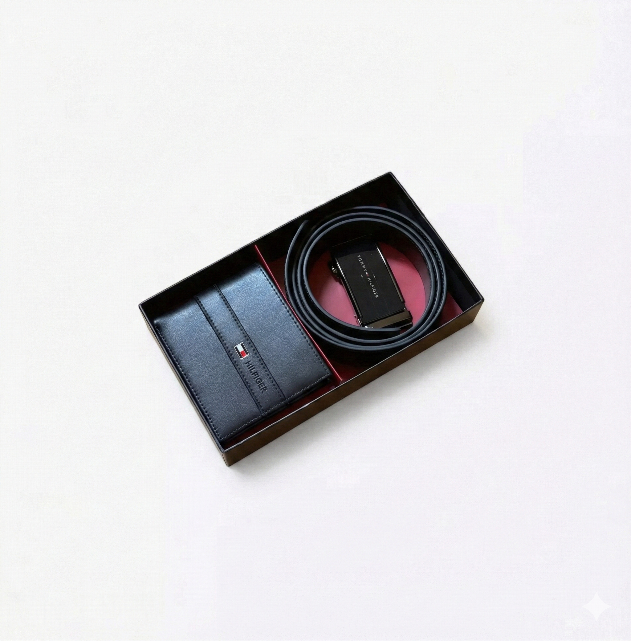 Black belt and wallet set in a box on a white background