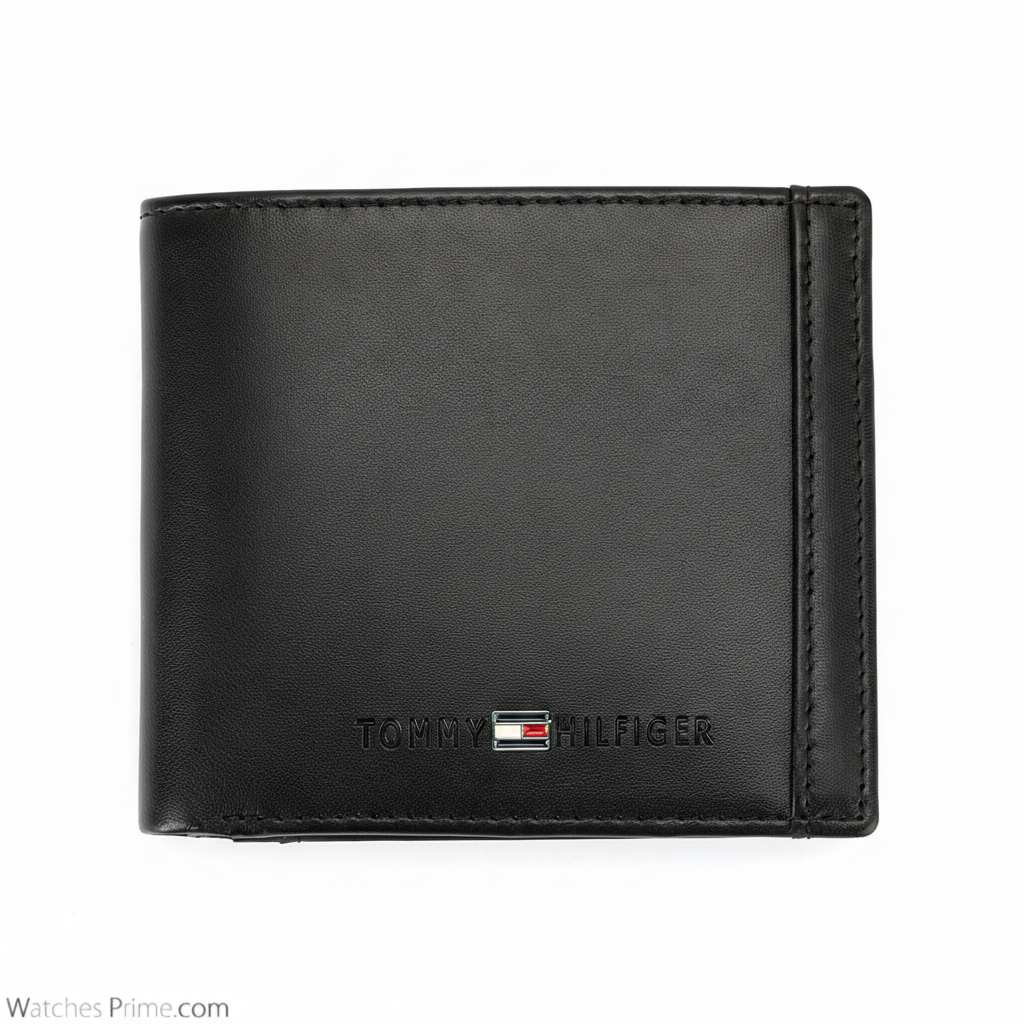 Detailed close-up of the interior of a Tommy Hilfiger black wallet featuring the "Genuine Leather" embossed stamp and neat card slots