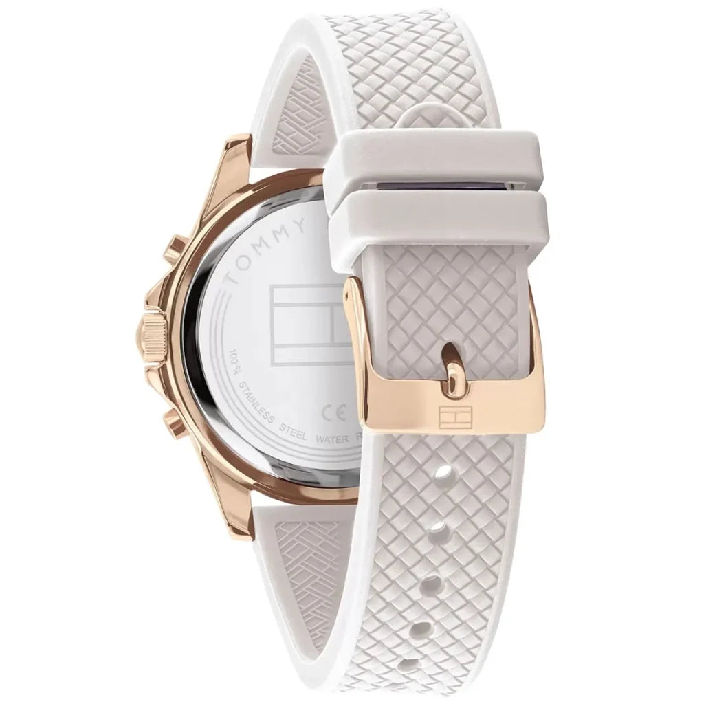 Woman wearing elegant sporty navy and gold Tommy Hilfiger Lori 1782199 watch