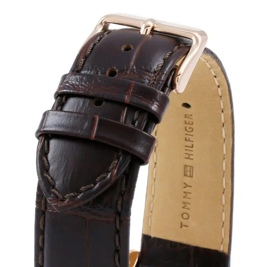 Right side view of Tommy Hilfiger 1791118 showing gold stainless steel case and navy bezel