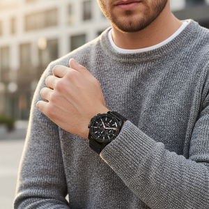 Man wearing bold all-black Tommy Hilfiger Mason 1791935 watch with steel bracelet