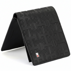 Side perspective of a standing Tommy Hilfiger brown genuine leather bifold wallet showcasing its elegant profile and high-quality stitching