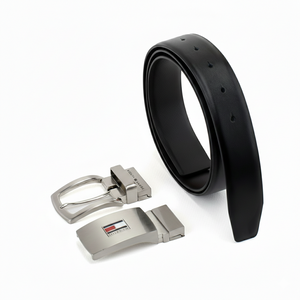 Tommy Hilfiger men's reversible leather belt gift set showing the sleek black side with two interchangeable silver metal buckles: a plaque buckle and a pin buckle