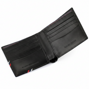 A perspective view of the Tommy Hilfiger men's bifold leather wallet fully opened, highlighting the sleek interior layout and premium stitching