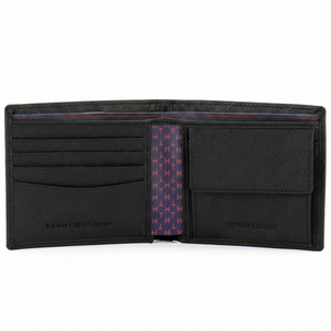 Interior view of an open Tommy Hilfiger men's black leather wallet featuring card slots on the left and a removable passcase insert with a clear ID window on the right.