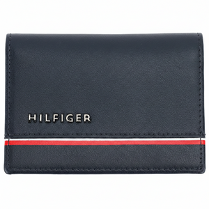 Front view of a Tommy Hilfiger men's navy blue genuine leather card case wallet with a silver-toned metal logo and iconic horizontal flag stripe
