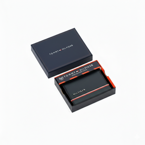 Authentic Tommy Hilfiger men's navy blue genuine leather card case wallet featuring RFID protection and a signature flag stripe, presented in a luxury branded gift box