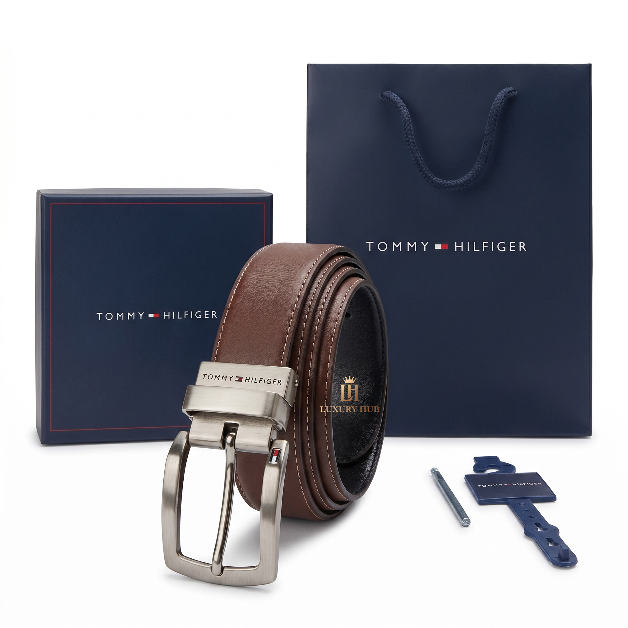 Tommy Hilfiger brown belt with silver buckle and packaging on a white background