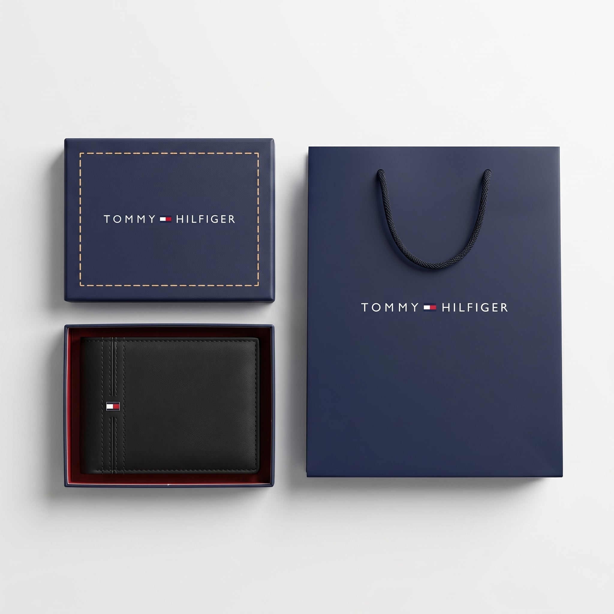 Full presentation of the Tommy Hilfiger mirror original smooth leather bi-fold wallet set with navy gift box and shopping bag