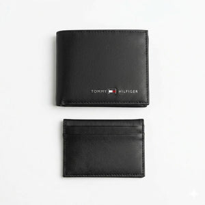 Studio product view of the Tommy Hilfiger mirror original black smooth leather bifold wallet next to its matching standalone minimalist card holder