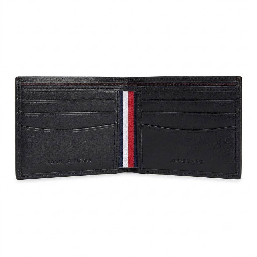 Live high-angle view of the Tommy Hilfiger leather wallet currency compartment displaying the navy fabric lining and original tracking barcode label