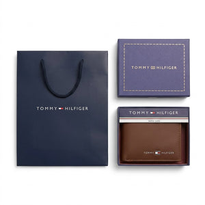 Full luxury presentation of the Tommy Hilfiger mirror original smooth brown leather wallet set with its branded navy gift box and matching shopping bag