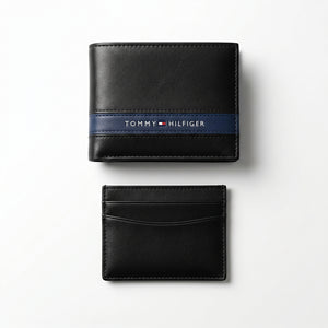 Straight front view product photography of the Tommy Hilfiger mirror original black leather wallet alongside its matching slim card case with vertical ribbon details