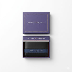 Top-down studio photograph of the Tommy Hilfiger mirror original leather wallet and card case set neatly placed inside its open premium navy gift box