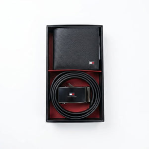 Top-down studio product view of the closed Tommy Hilfiger premium presentation gift box featuring a transparent window showcasing the smooth wallet and black belt buckle